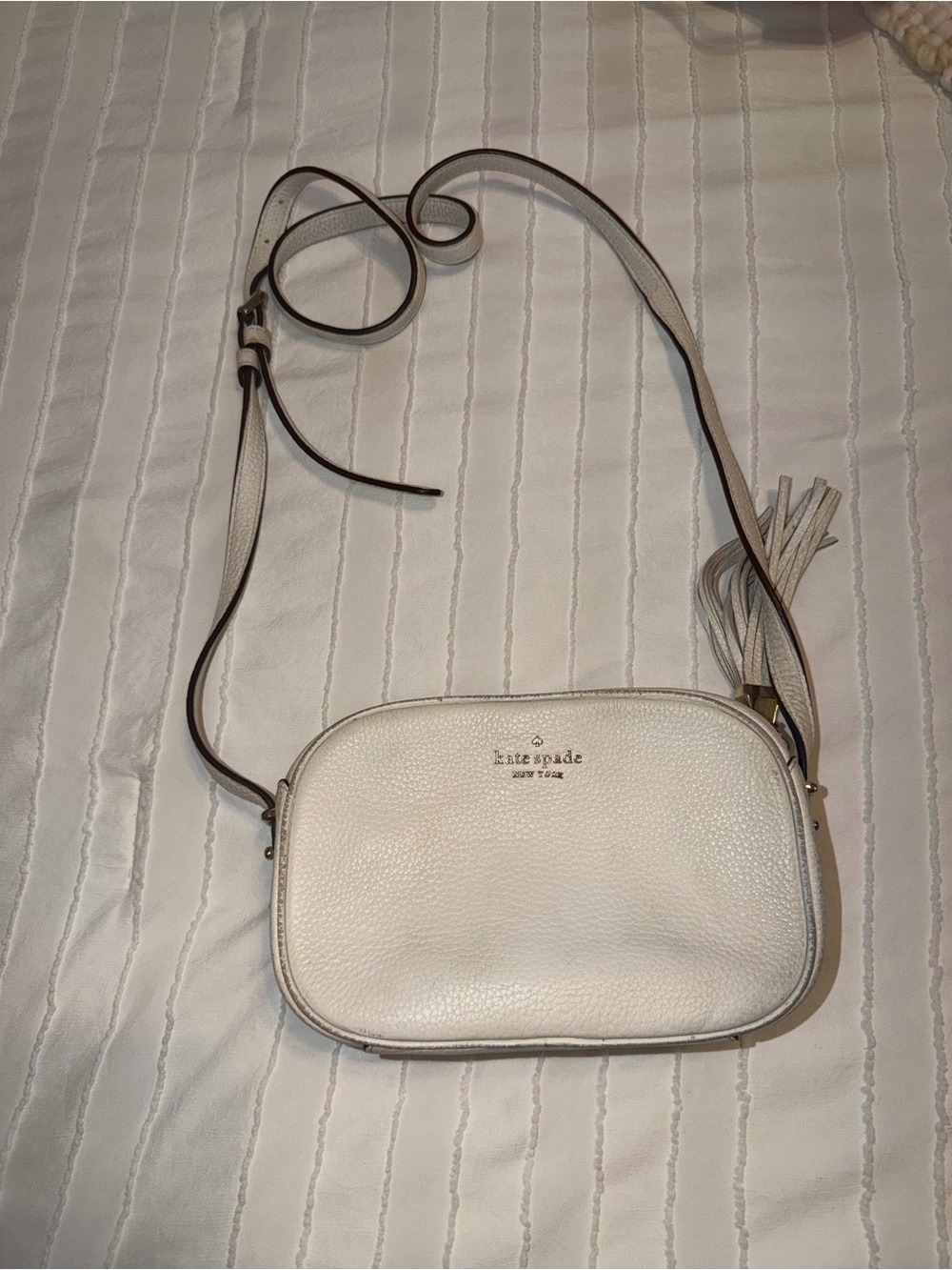 kate spade cream pebbled leather crossbody with tassel